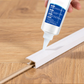 Edge strip adhesive to prevent peeling
