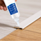 Edge strip adhesive to prevent peeling